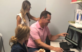 Orthopaedic high school internship, students observing x-rays on monitor