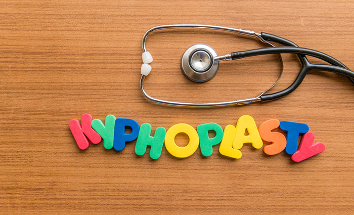 Colorful letters spelling out Kyphoplasty next to a stethoscope