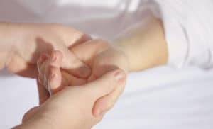 Woman's hand with arthritis - Arthritis Awareness Month: Debunking Arthritis Myths