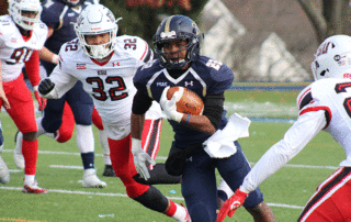 sports medicine doctor helping football player