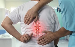 common spine problems - doctor examining patient's spine