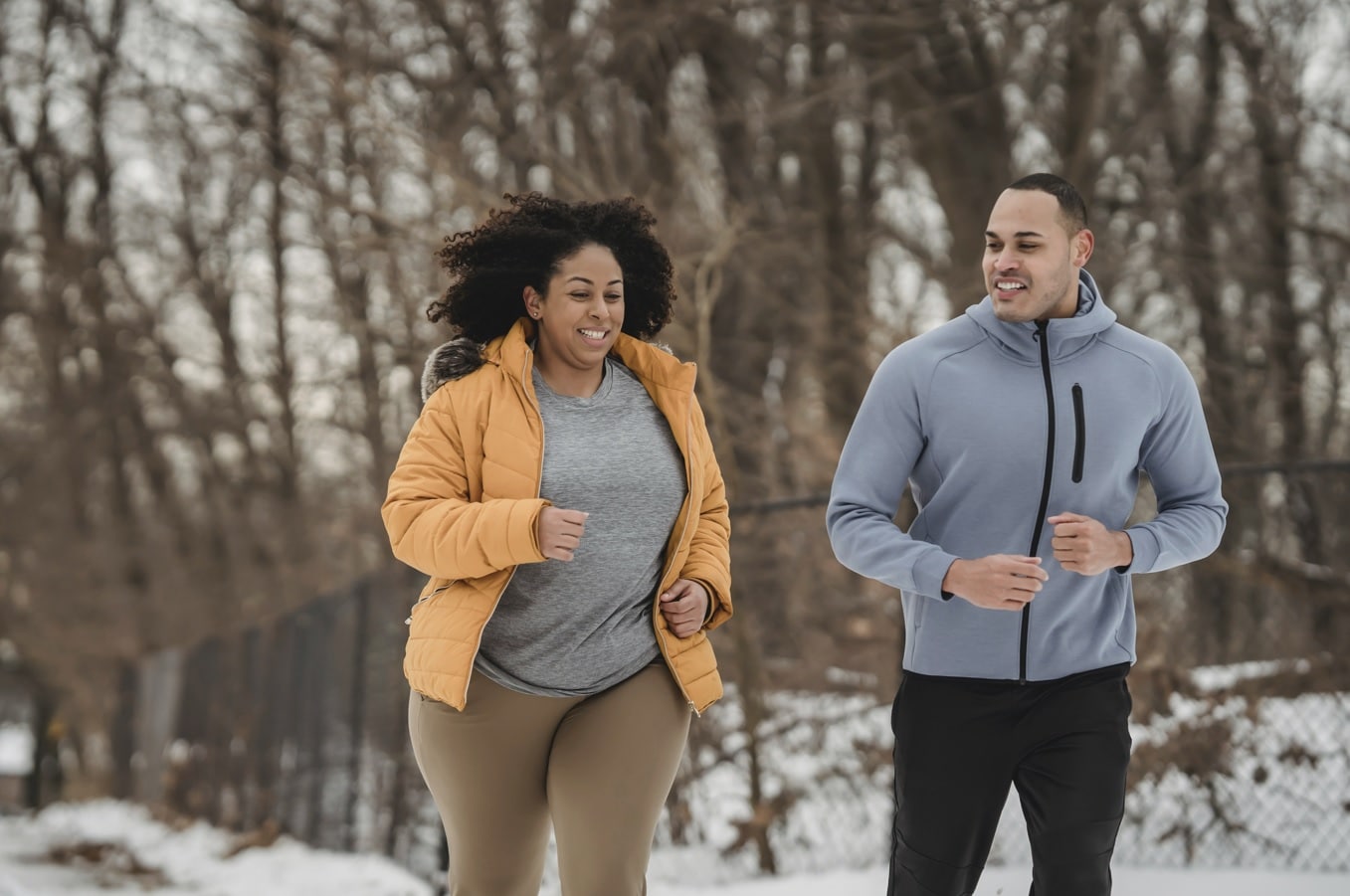 winter exercise photo by Julia Larson - man and woman running