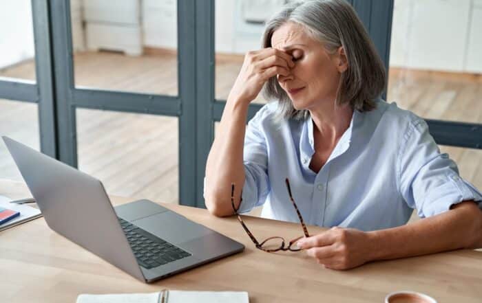 woman suffering from cervicogenic headaches