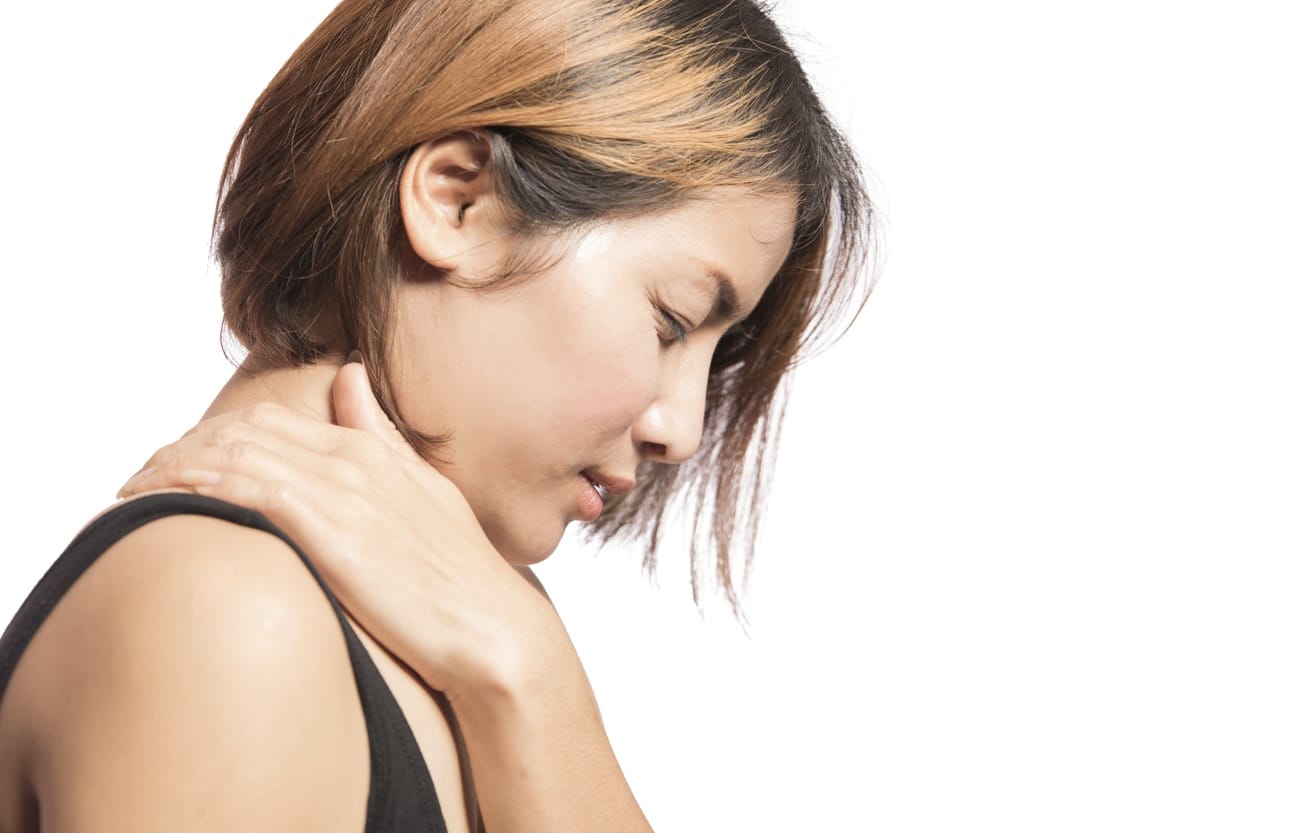 woman holding her neck in pain suffering from myofascial pain syndrome